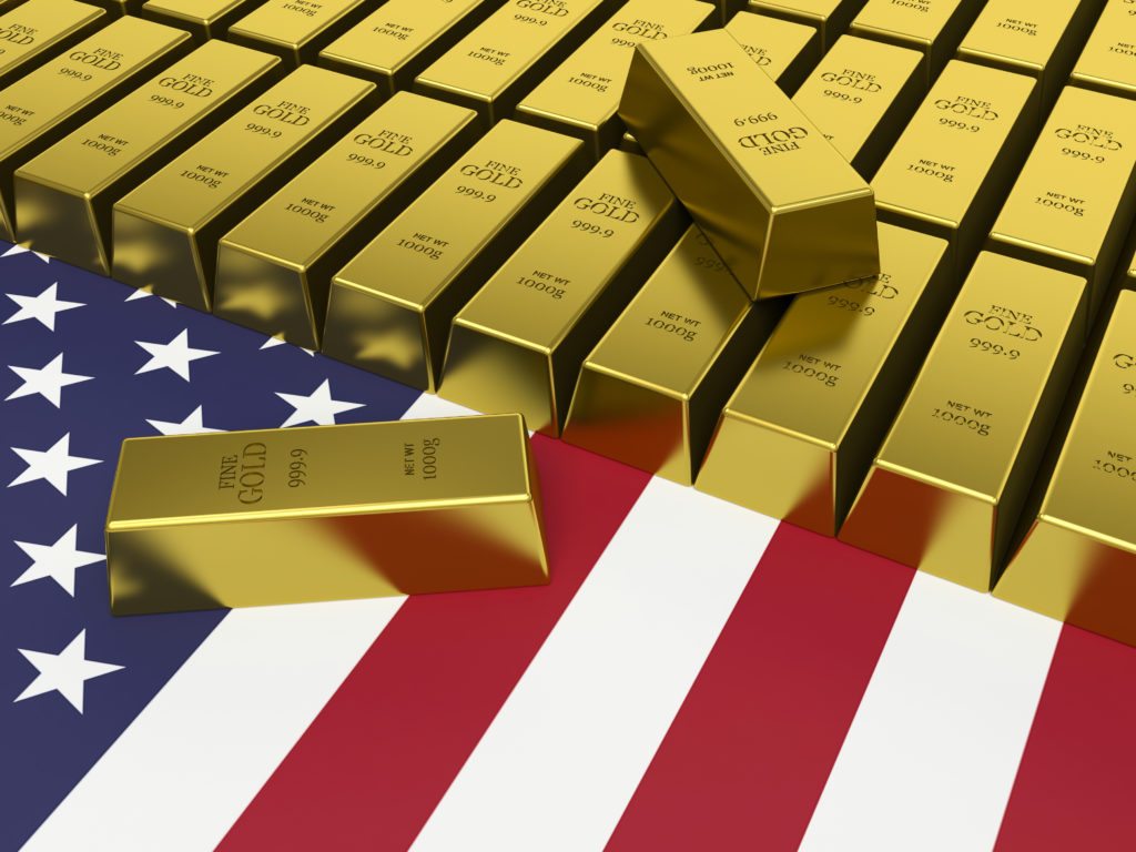 Gold bars on top of a United States flag.